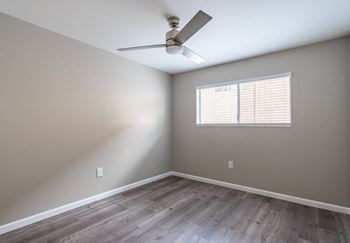 an empty room with a ceiling fan and a window at North View Terrace, California